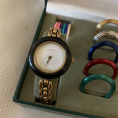 ladies gucci watch with interchangeable bezels